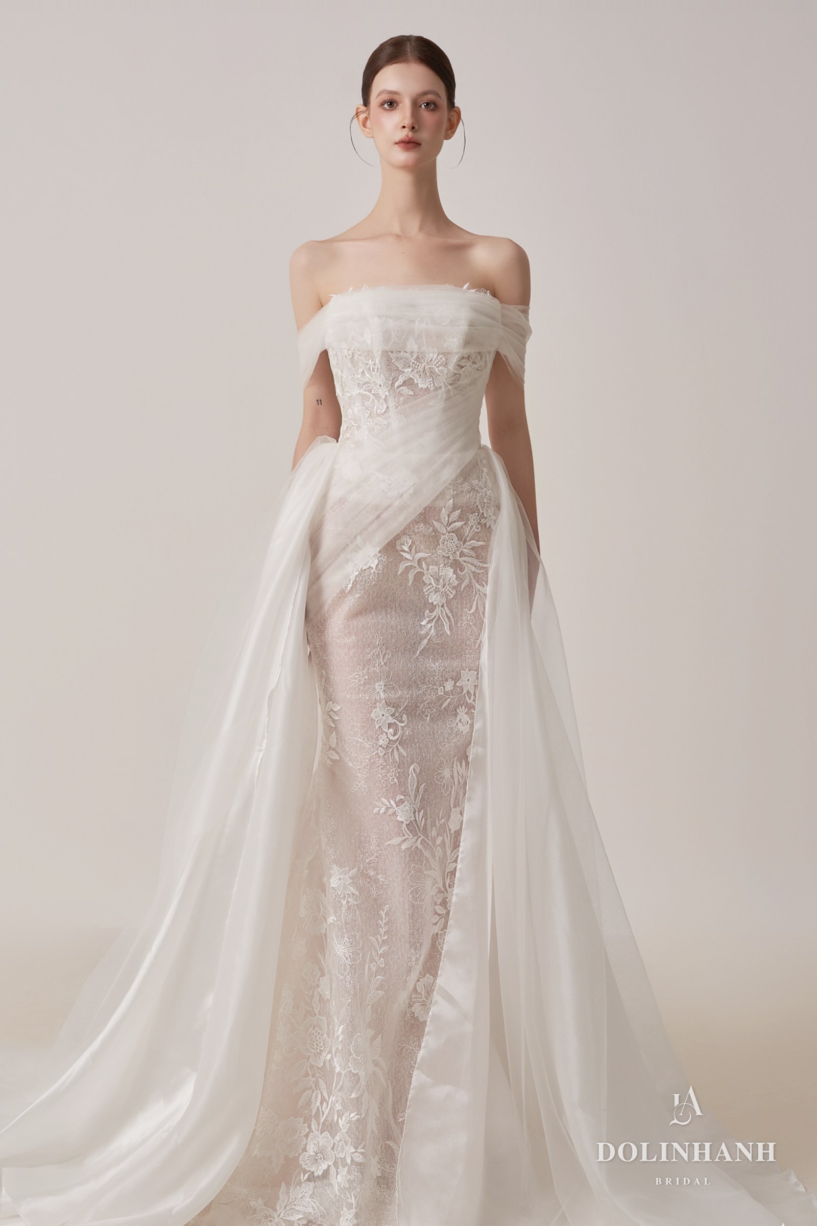 Lace sheath gown with a sheer overskirt